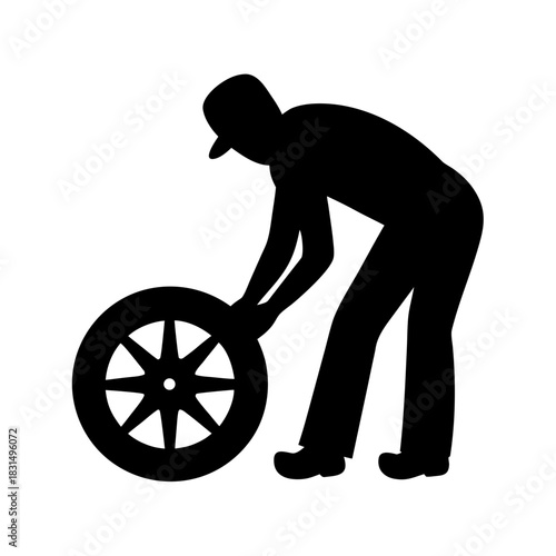 Mechanic silhouette changing a car tire on white background silhouette