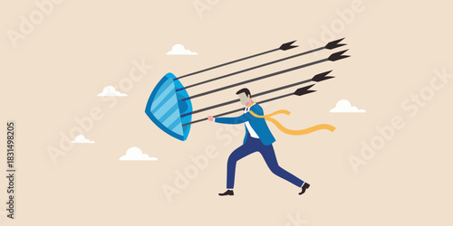 Businessman defending against incoming arrows with a shield