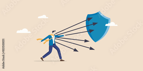 Businessman defending against arrows with a shield