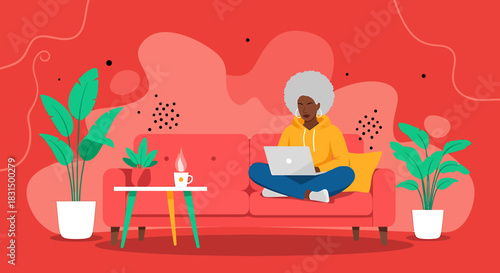 Woman working on a laptop on a couch surrounded by plants in a stylish apartment