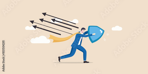 Businessman defending against incoming arrows with a shield