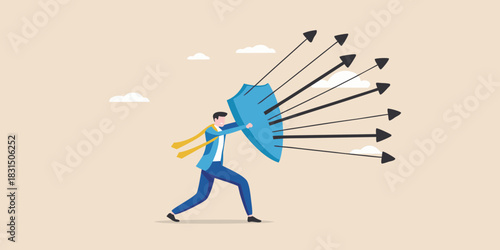 Businessman defending against incoming arrows with a shield