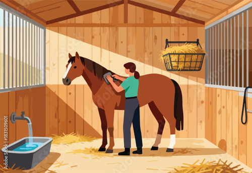 In a wooden stable, a person brushes a brown horse. Hay sits around. A water source is in view