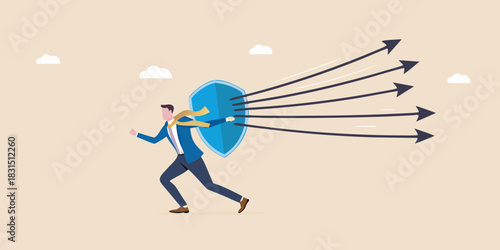 Businessman defends against incoming arrows with a shield