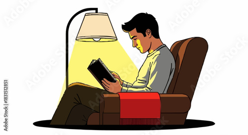 A man sitting comfortably in an armchair, engrossed in reading a book under the warm glow of a floor lamp.