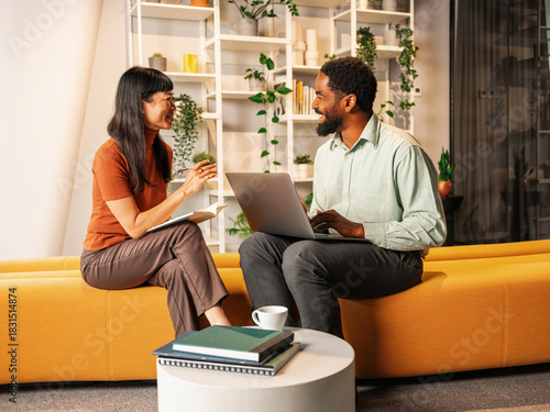 Friendly Business Meeting Between Colleagues in the Office Lounge