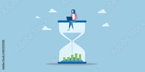 Woman working on laptop on top of hourglass with growing bar chart