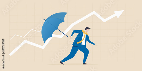 Businessman with umbrella protecting upward trending graph