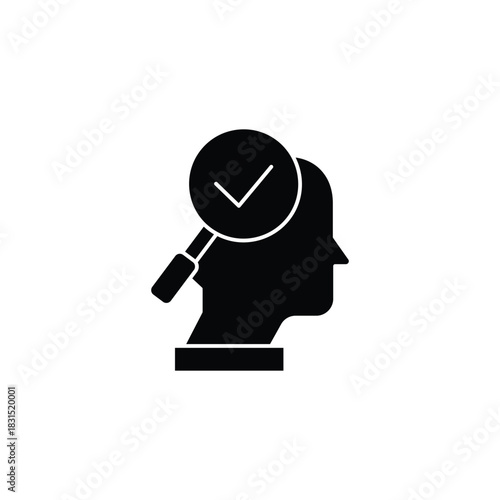 Black silhouette of a human head with a magnifying glass and a checkmark, symbolizing mental verification or self-assessment.