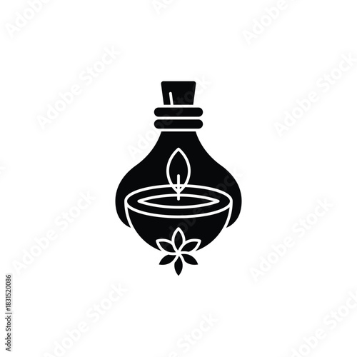Black silhouette icon of a traditional oil lamp or candle in a pouch, with a flower design, representing spa, wellness, or aromatherapy.