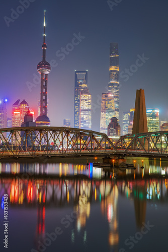 The night view of the modern city skyline and the external Baidu Bridge in Shanghai, China, on November 20, 2025