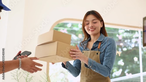 Deliveryman confirming parcel with cafe owner woman using smartphone, representing digital signature, cashless payment, efficient collaboration between delivery service and small business logistics