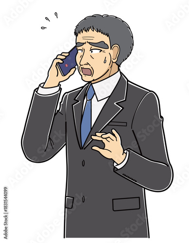 困った表情で電話しているスーツの中年男性（上半身）