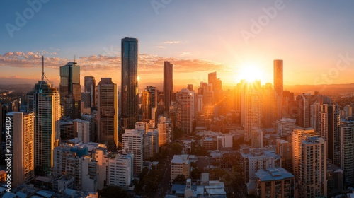 Vibrant Sunrise Over a Modern City Skyline with Skyscrapers and Warm Golden Light Reflecting on Glass Windows