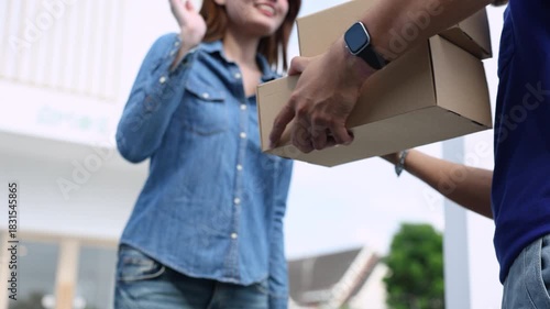 Deliveryman handing parcels to young woman at home door, professional courier showing friendly service, fast shipping, customer satisfaction, small business online order success, delivery occupation