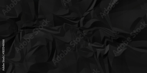 Dark black crease billboard paper rough obsolete wrinkle. Cardboard black paper crumpled satin fabric ripped cloth decoration background	
