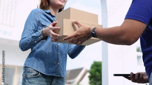 Deliveryman handing parcels to young woman at home door, professional courier showing friendly service, fast shipping, customer satisfaction, small business online order success, delivery occupation