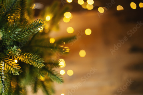 Wallpaper Mural Festive golden bokeh among fir branches, warm Christmas background. High quality photo Torontodigital.ca