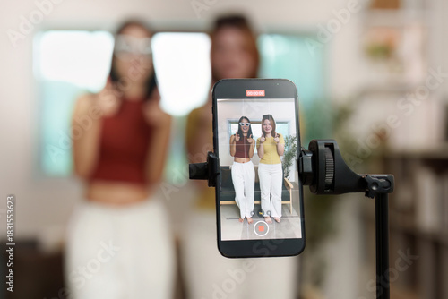 Social Media Recording. Friends posing for a video on a smartphone camera.