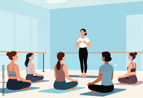 Women in a yoga studio meditate in lotus pose around an instructor guiding with hands on chest