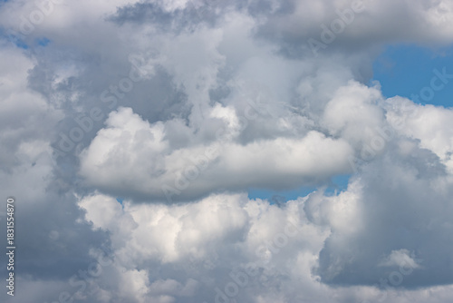 A cloudy sky with a blue sky in the background