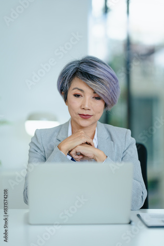 Asian senior businesswoman meeting vdo conference in office Free Download Asian senior businesswoman meeting vdo conference in office - GFXLoad