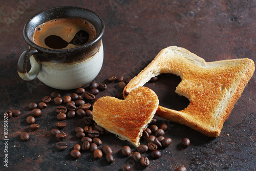 Coffee and toast with heart shape cutout