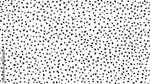 Black and white abstract terrazzo pattern with small, irregular geometric shapes scattered randomly, creating a chaotic, modern, and minimalist design with a stylish texture