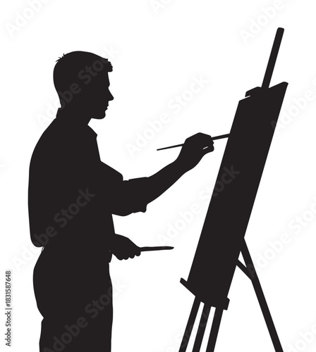 Black silhouette of a male artist standing in profile while painting on a canvas with a brush, holding a palette and working at a tripod easel in a creative studio
