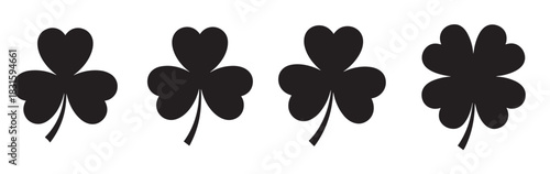 Four black clover leaf silhouettes including a lucky four-leaf clover and three shamrocks in a simple graphic icon set for St. Patrick's Day and good luck concepts