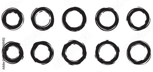Set of ten black hand-drawn circles with a rough brush stroke texture, a collection of minimalist round frames and artistic graphic design elements