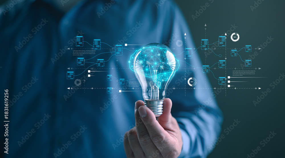 Obraz premium Hand holding a glowing light bulb with digital brain and data flow interface, symbolizing artificial intelligence, big data innovation, creative technology, and futuristic digital transformation.