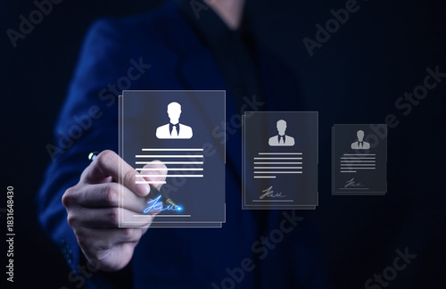 Fototapeta Naklejka Na Ścianę i Meble -  A business professional selecting a digital resume interface with glowing signature, representing recruitment, HR technology, candidate evaluation, online hiring process, modern workforce management.