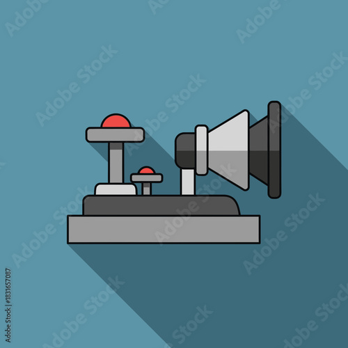 Gray device with two red buttons and a speaker-like structure.