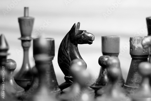 Old retro wooden chess pieces, intellectual strategy game.