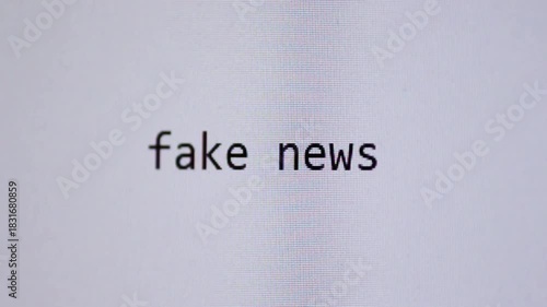 Words “fake news” being typed on a blank digital screen, representing misinformation, online deception, media distortion, and modern information risks in the digital age