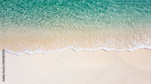 Fototapeta Naklejka Na Ścianę i Meble -  Crystal ocean water pristine white sand gentle foamy wave turquoise sea minimal beach