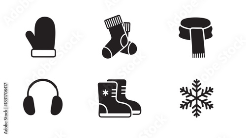 Collection of winter clothing and snowflake icons in black silhouette style isolated on white background