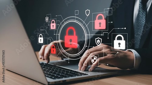 Cybersecurity concept with glowing locks and shields over a person typing on a laptop.