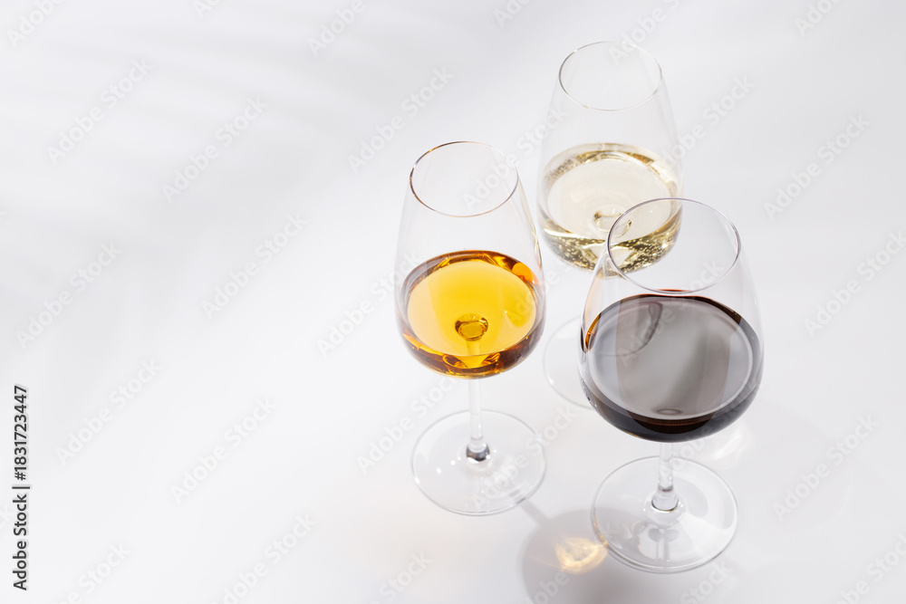 Fototapeta premium Different wine glasses on white background