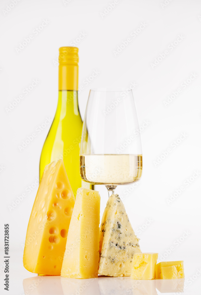 Naklejka premium Assorted cheeses and wine on white background