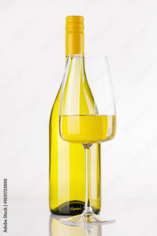 Fototapeta premium White wine bottle and glass on white background