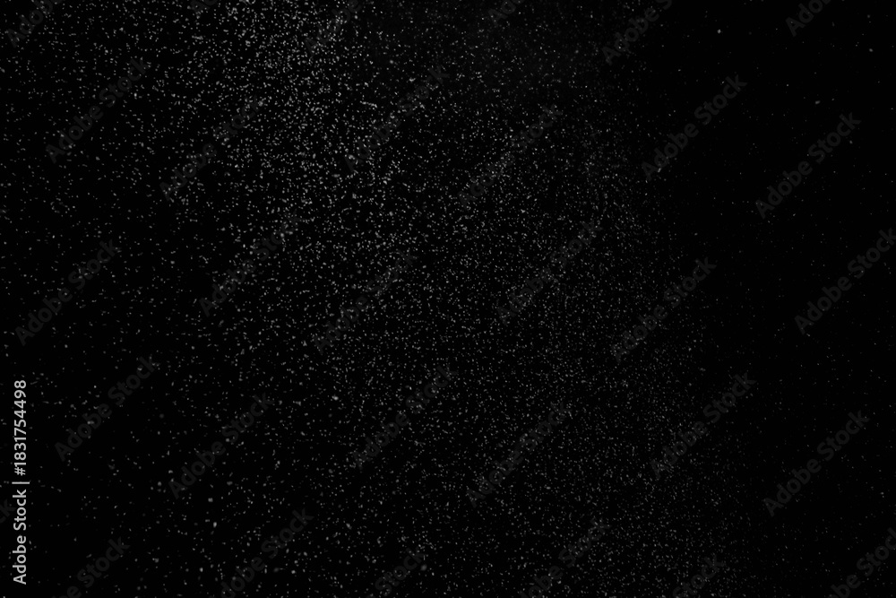 Obraz premium The falling white snow on a black background