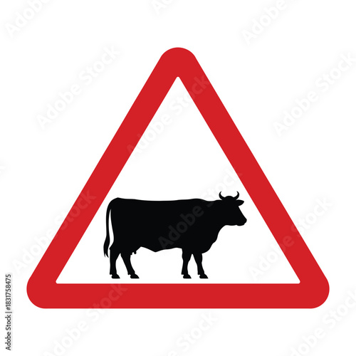 Warning traffic sign showing a black silhouette of a cow inside a red triangle border, indicating danger of cattle crossing road