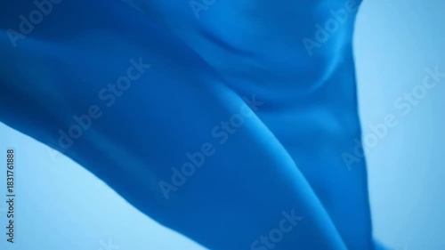 Wallpaper Mural Abstract Blue Fabric Flowing in the Wind Against a Light Background. Torontodigital.ca