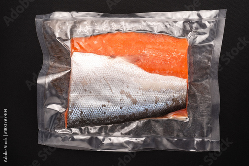 Vacuum Packed Salmon Fillet on Dark Background