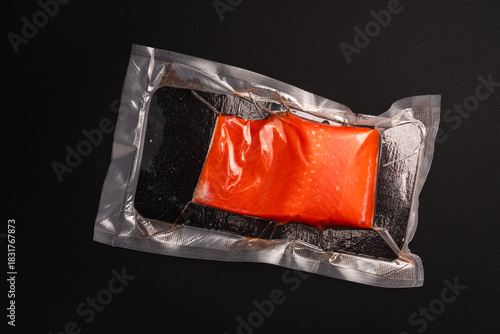 Vacuum Packed Salmon Fillet on Dark Background