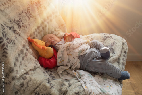 Newborn Sleeping Peacefully in Warm Morning Sunlight
