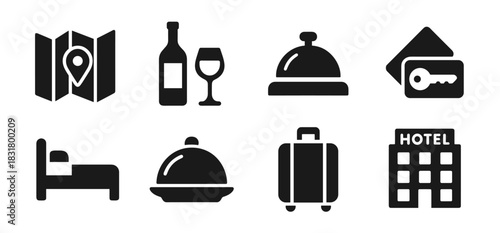 Hotel and travel icon collection in black. Includes map, wine glass, service bell, room key, bed, food tray, suitcase, and hotel building