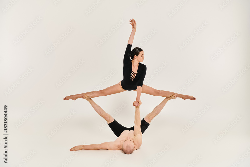 Fototapeta premium Dynamic acrobatic performance showcasing vivid movements and youthful energy in a studio
